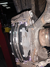 lubricated brake caliper bracket with brake pads installed